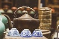 old kettle and cups in old antique shop in China