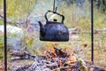 Old kettle over camp fire Royalty Free Stock Photo