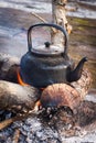 Old kettle over the fire.