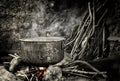 Old kettle sitting on hot fire Royalty Free Stock Photo