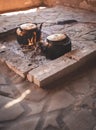 Kettles are boiling on an open fire in a Bedouin camp in the Wadi Rum desert in Jordan Royalty Free Stock Photo