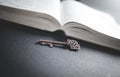 Old key with bible. Concept of wisdom and knowledge Royalty Free Stock Photo