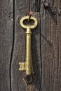 Old key of gold colour. Royalty Free Stock Photo