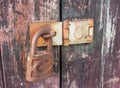 Old key lock on wooden wall Royalty Free Stock Photo