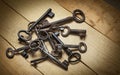 Old keys on a background of wooden boards