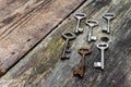 keys of different sizes on rustic weathered wood planks Royalty Free Stock Photo