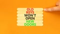 Old keys do not open new doors symbol. Concept words Old keys do not open new doors. Businessman hand. Beautiful orange background Royalty Free Stock Photo