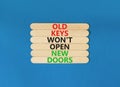 Old keys do not open new doors symbol. Concept words Old keys do not open new doors. Beautiful blue table blue background. Royalty Free Stock Photo