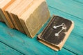 Old keys on a old book and stack of antique books on blue wooden Royalty Free Stock Photo