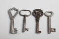 Old keys to different locks are spread out on the table