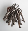 Old keys to different locks are spread out on the table