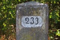 An old kilometer stone on the Old Rhine near Eggenstein in Germany