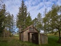 An Old Kirk, Bothy or Meeting Place Building in a remote valley in the Angus Glens set within a Forest Glade on a fine Morning. Royalty Free Stock Photo