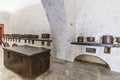 Old kitchen interior full of copper pots