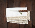 Old knife and embroidered white dishcloth with lace Royalty Free Stock Photo