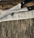 Old knives and Chopping board on wooden background Royalty Free Stock Photo