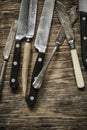 Old knives on wooden background Royalty Free Stock Photo