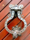 Old knocker on the wooden gate of the house - close up Royalty Free Stock Photo