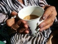 old ladies hands holding a cup of coffee Royalty Free Stock Photo