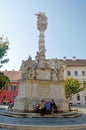 3 old ladies sat at the base of the Trinity column chatting Sopron Hungary