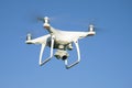 Flying quadrocopter `Phantom 4 Edvansed` close-up against the cloudless sky Royalty Free Stock Photo