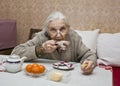 Old lady drinking tea Royalty Free Stock Photo