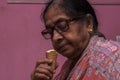 An old lady enjoying cone ice cream. Selective focus Royalty Free Stock Photo