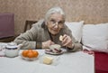 Old lady drinking tea Royalty Free Stock Photo