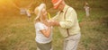 The Old Lady And Gentleman Dancing In The Garden2 Royalty Free Stock Photo