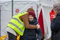 Old lady getting a hug at the Tesco Ukrainian refugee centre