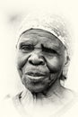 An old lady from Ghana poses