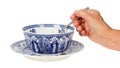 Old Lady (hand) Holding A Spoon In An Antique Dutch Soup Bowl In