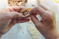 Old lady hands make dumplings. Royalty Free Stock Photo