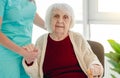 Old lady leaning on nurse hand Royalty Free Stock Photo