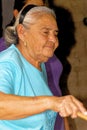 Old lady making tortillas