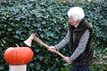 Old lady modelling a pumpkin