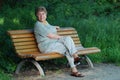 Old lady on park bench Royalty Free Stock Photo