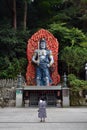 An old lady praying in front of the God statue around Nanzoin, J