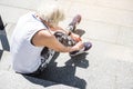 Old lady is preparing for training outside on ladder steps Royalty Free Stock Photo