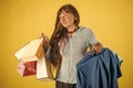 Old lady with present package on yellow background Royalty Free Stock Photo