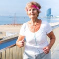 Old lady running beside beach