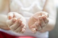 Old lady's hand with open palm. Elderly lady is waiting for help. Elderly, Aging concept, with white background Royalty Free Stock Photo