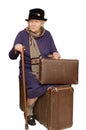 The old lady sits on a suitcase Royalty Free Stock Photo