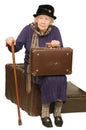 The old lady sits on a suitcase Royalty Free Stock Photo