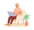 Old lady sitting on armchair, holding laptop and typing. Modern senior woman working on computer