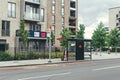 An old lady waiting for a bus on bus stop in London