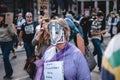 Old lady wearing mask at Save Our Children Protest against Children Trafficking