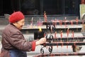 Old lady works in Taoist temple