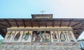 The old Lainici Monastery on a summer`s day, detail of the exterior painted wall