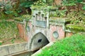 Old Lake Biwa canal tunnel mouth with the tunnel name on the sign. Royalty Free Stock Photo